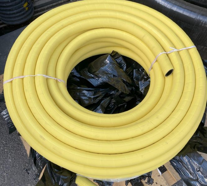 Coiled yellow air hose on pallet